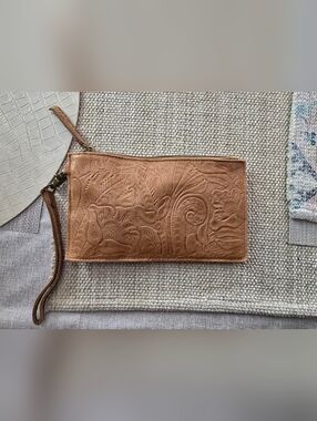 American Leatgwr Co Tooled Leather Wristlet Clutch. Has Charge Pack Built In.